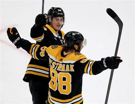 Bruins keep winning, defeating Toronto in OT, but lose Charlie McAvoy to injury